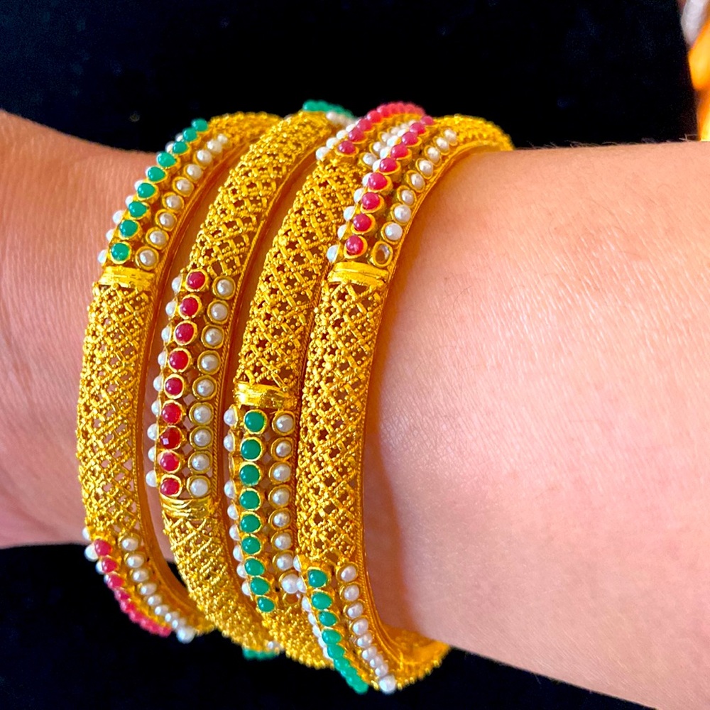 NWOT.  4 gold toned Indian bangles.